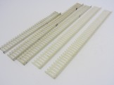 4 white Hornby Gauge 0 Lengths of Platform Fencing and 1 short length