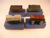 4 x Hornby Dublo Tinplate Wagons.  LMS and NE Coal Wagons, LMS High Sided Coal Wagon and Silver ''Esso''.  All Boxed