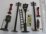 Various lead accessories and one tin advertising sign